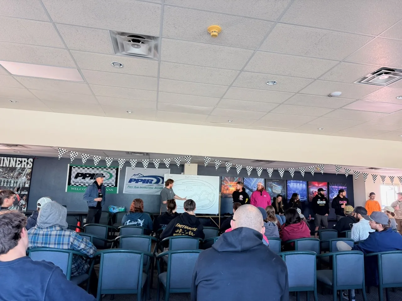 Students watching an instructor at the whiteboard during the classroom session